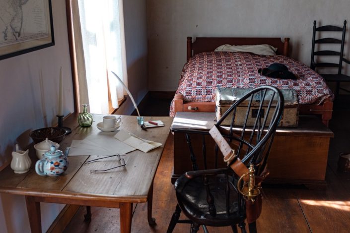 Herkimer Home State Historic Site Officers’ Quarters with desk and bed. Photo by Sarah Rogers.