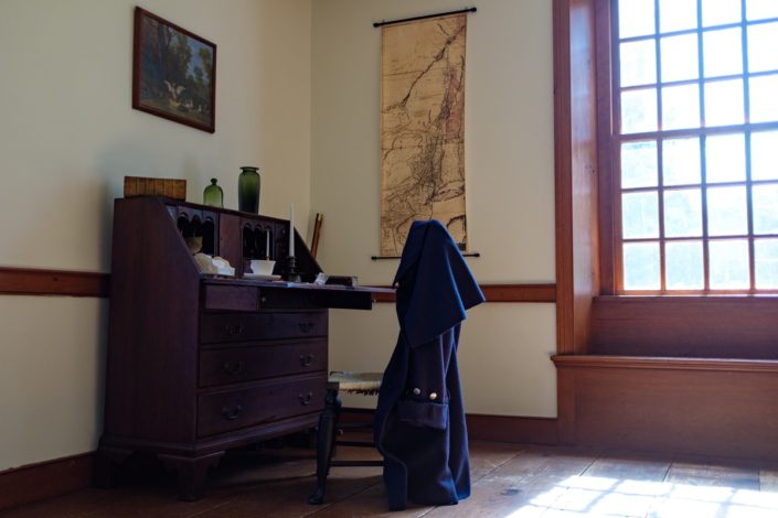 Herkimer Home State Historic Site desk with coat. Photo by Sarah Rogers.
