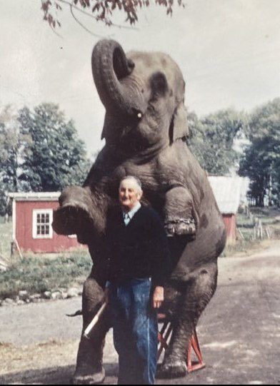 Milo, with Marie the elephant, at the Smith Brothers Farm