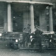 Railway Express Agency employees Al Munger (on left - Al later became Little Falls fire chief) and Jimmy Fitzgerald (on right) pictured with cages of homing pigeons outside of the company office once housed in the Old Bank Building. Photo courtesy of the Little Falls Historical Society.
