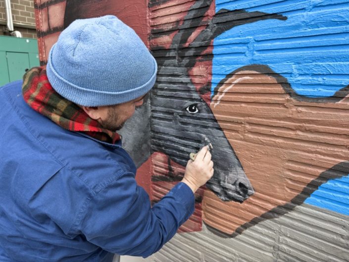Justin Como as Lead Artist at the Stone Soup American Bistro and Beer Garden Mural Event. Justin Como as Lead Artist at the Stone Soup American Bistro and Beer Garden Mural Event.