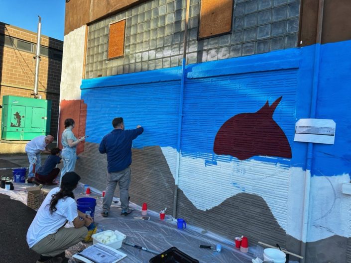 Justin Como as Lead Artist at the Stone Soup American Bistro and Beer Garden Mural Event. Justin Como as Lead Artist at the Stone Soup American Bistro and Beer Garden Mural Event.