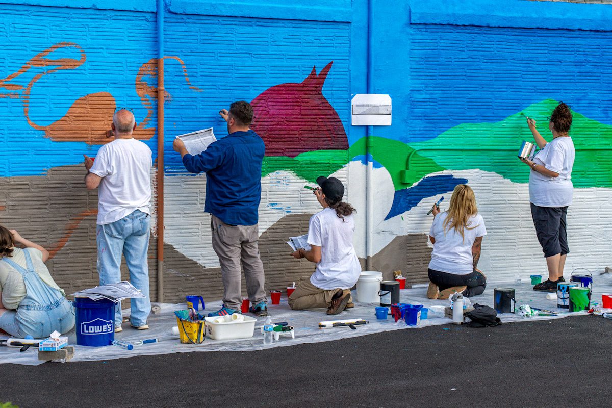 Featured Mohawk Valley Artist Daniel Marrone working with The Art Thing Collaborative on the mural at the Stone Soup American Bistro Beer Garden