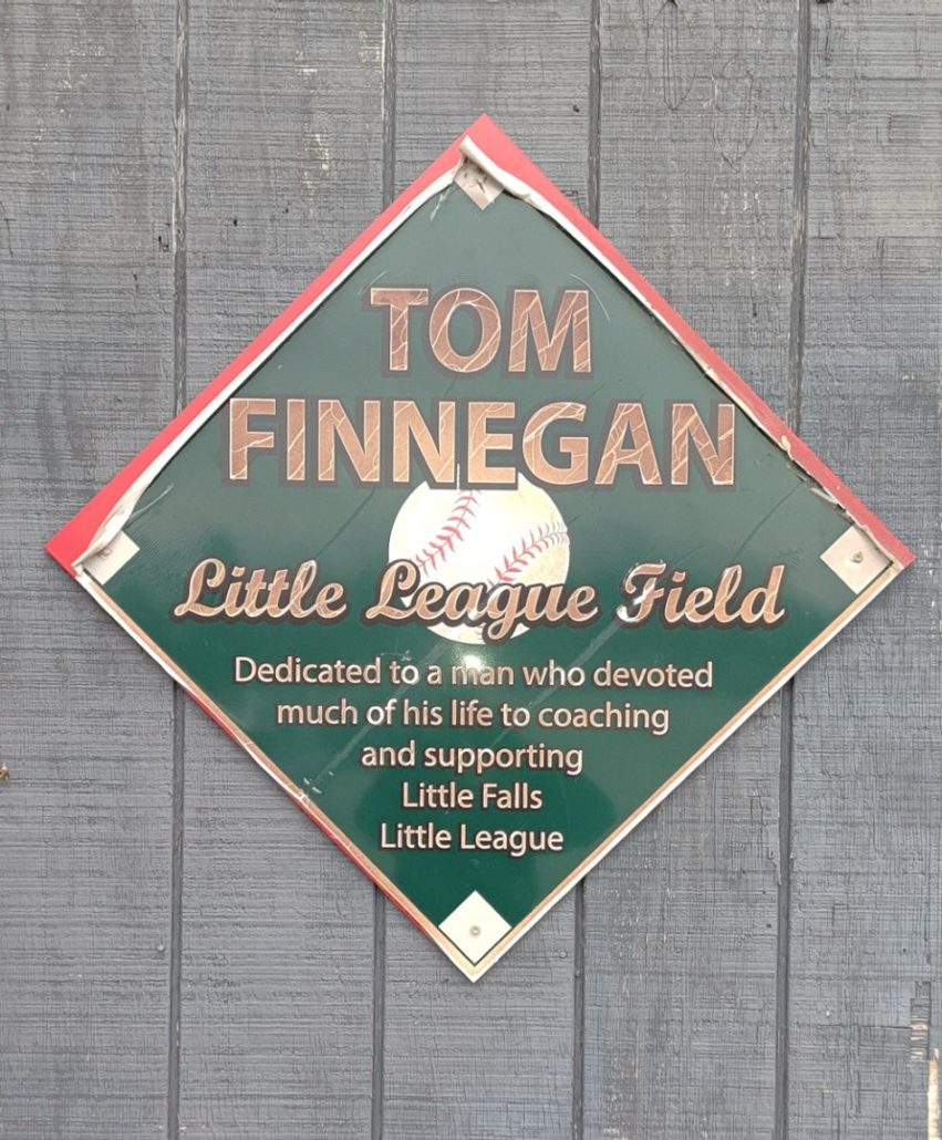 Dedication sign located at Little Falls Little League field.