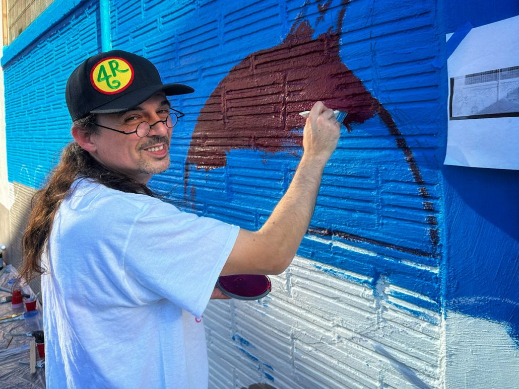 Featured Mohawk Valley Artist Daniel Marrone working with The Art Thing Collaborative on the mural at the Stone Soup American Bistro Beer Garden