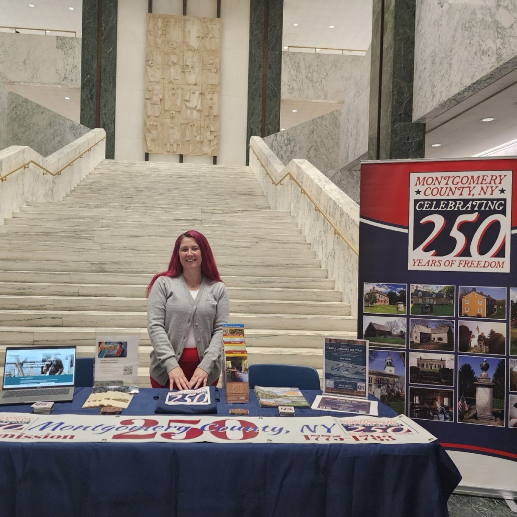 Christie Dingman, Staff Assistant for the Montgomery County Business Development Center/Tourism, represented the Montgomery County America 250 Commission and Visit Montgomery at The Well in the Legislative Office Building, where living historians, historic sites, and America 250 commissions from across New York State showcased Revolutionary War commemoration efforts leading up to America’s 250th anniversary.