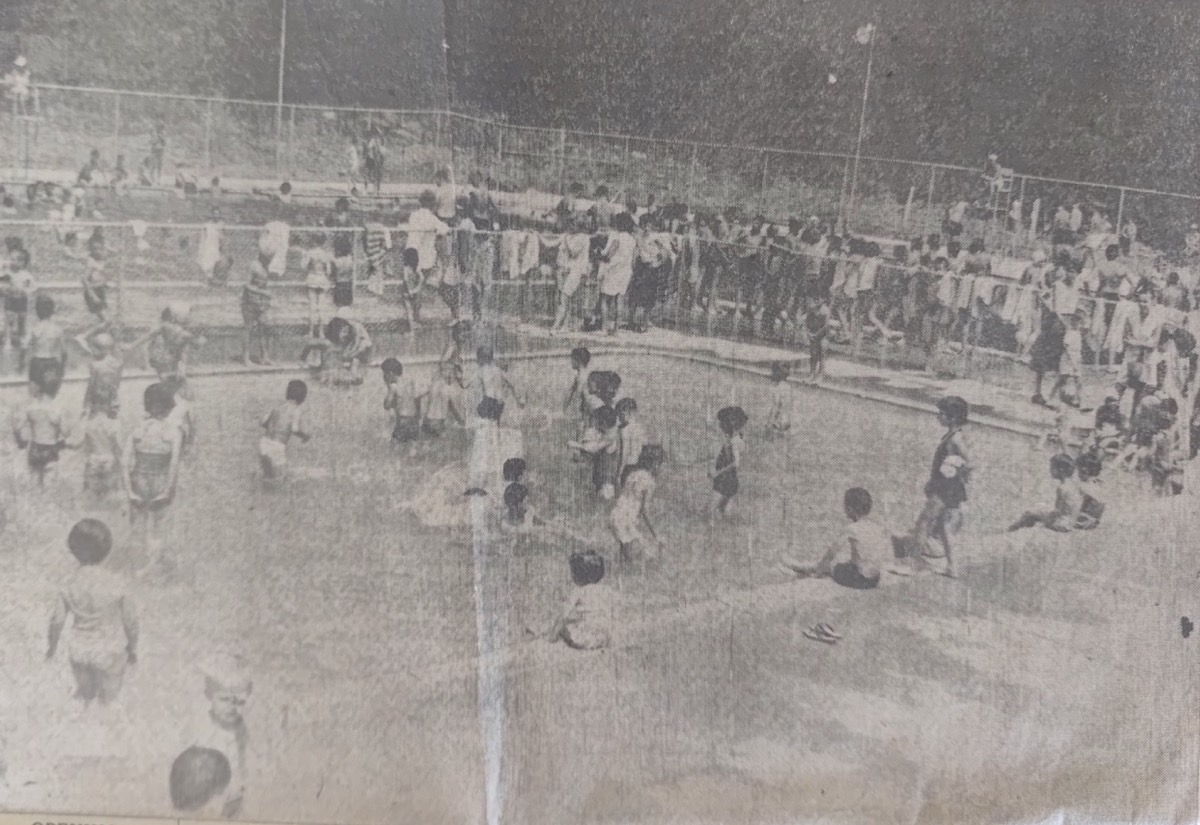 OPENING AFTERNOON CROWD taxed tacilities at the new Little Falls Francis S. Skinner Municipal Pool. In foreground is fenced off area for small children, with shallow water. Swimming area for older persons is considerably larger and diving area is at right.
